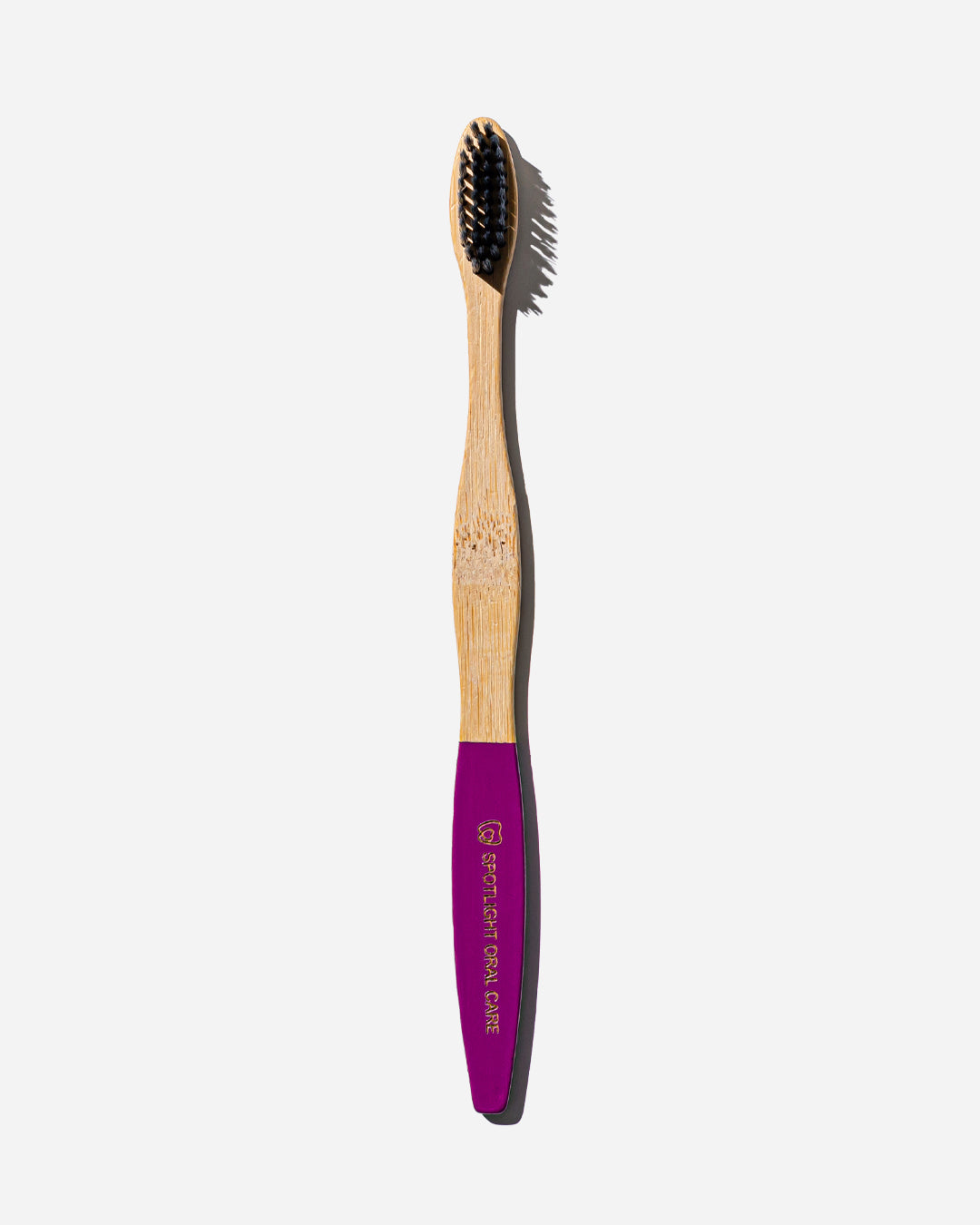 Spotlight Oral Care Bamboo Toothbrush with soft bristles and naturally antibacterial bamboo handle for sustainable oral hygiene