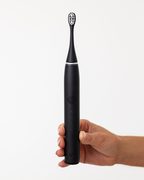 Dentist-developed Sonic Pro Toothbrush in Jet Black designed to remove stains, and promote oral health for a brighter and healthier smile at home