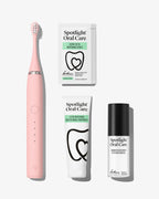 Spotlight Oral Care Sonic Pro Starter Bundle in Blush pink featuring electric toothbrush, whitening strips, accelerator gel, and professional toothpaste​