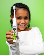 Dentist-developed kids' toothbrush with a textured grip handle, promoting independence and effective plaque removal​