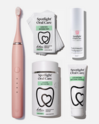 Spotlight Oral Care Sonic Pro Starter Bundle in Blush Pink featuring electric toothbrush, whitening strips, accelerator gel, and professional toothpaste