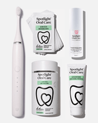 Spotlight Oral Care Sonic Pro Starter Bundle in Pure White featuring electric toothbrush, whitening strips, accelerator gel, and professional toothpaste​