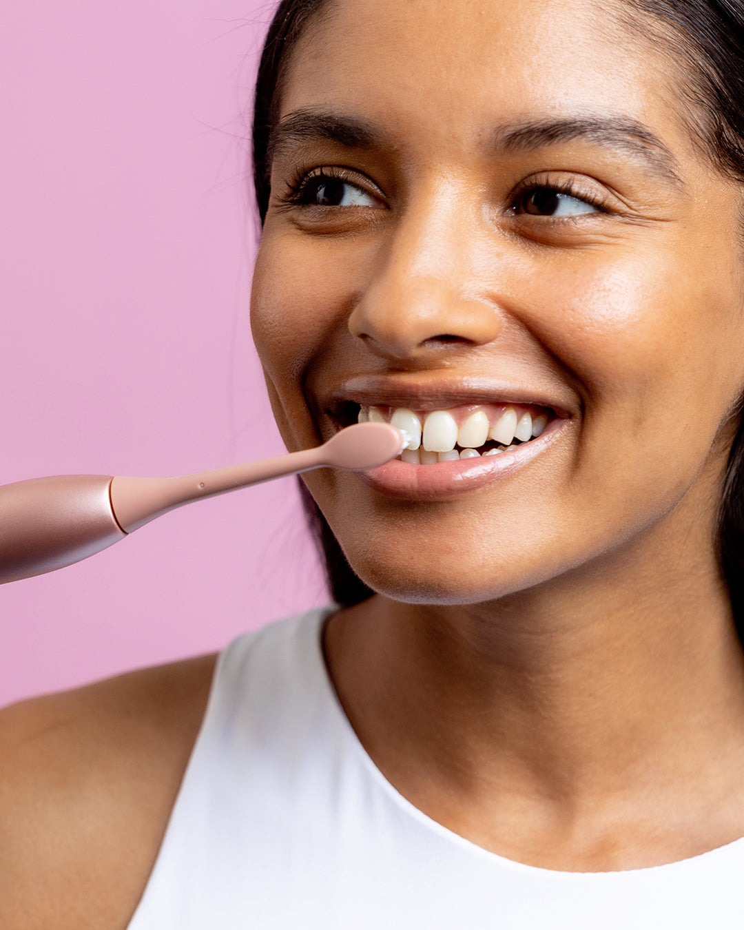 Dentist-developed electric toothbrush in rose gold designed to target cavities, bad breath, and staining for improved oral health​