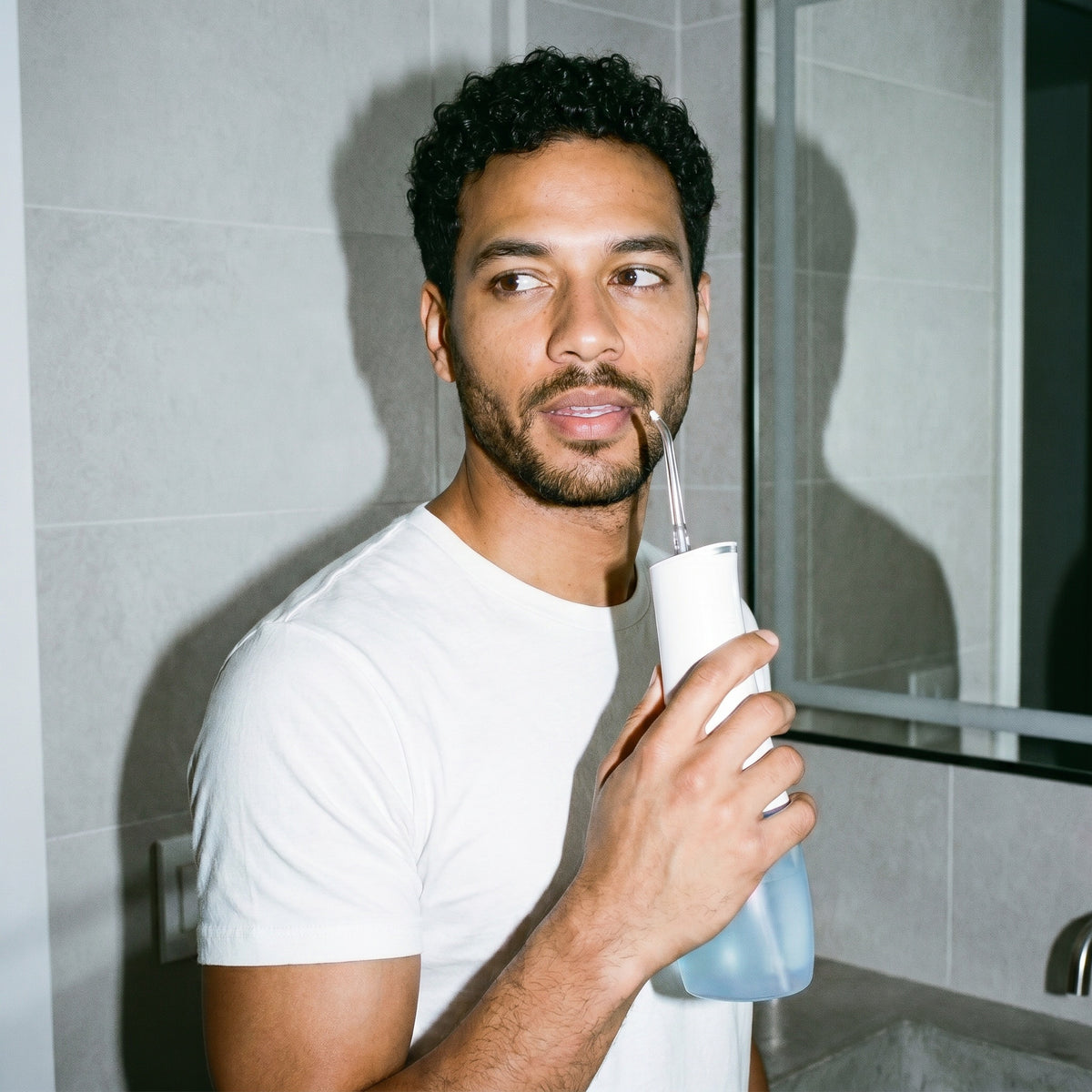 Man using the Spotlight Water Flosser